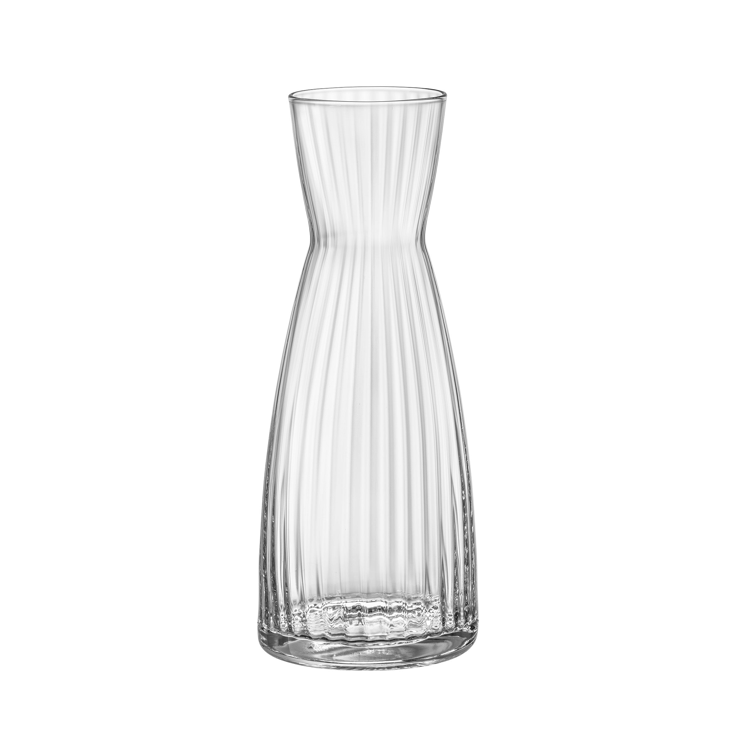 A clear Exclusiva glass carafe with a sleek design, featuring vertical ridges and a narrow neck.